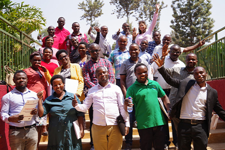 "Group poses for a photo with Dr. Marty"