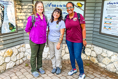 "Dr. Tazaz posing with two other women at a State park"
