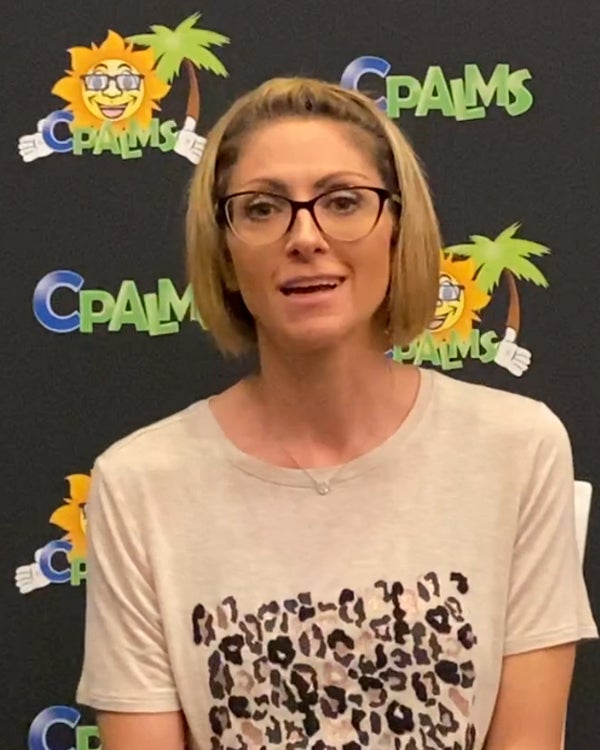 Photo of a teacher seated in front of a CPALMS back drop conducting an interview