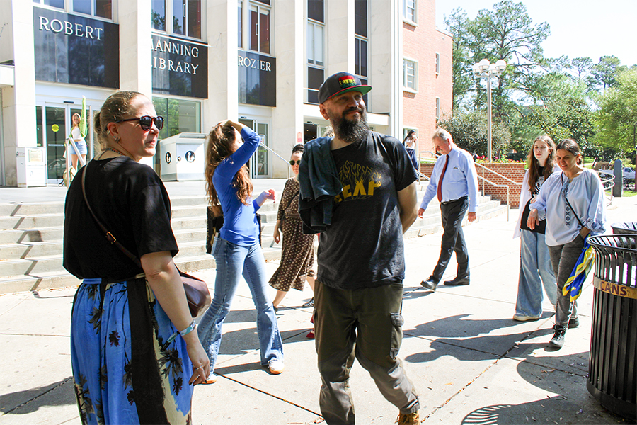 DakhaBrakha walking outdoors on the FSU campus at Strozier Library