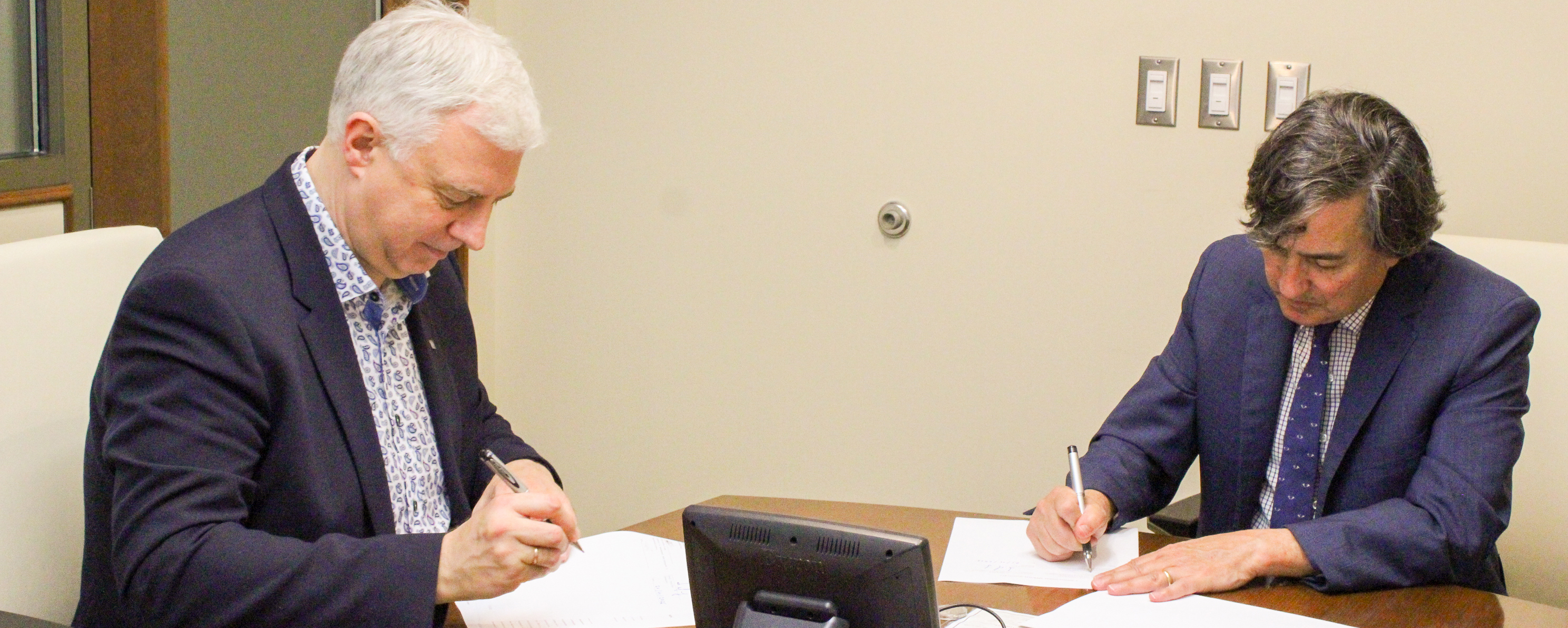 Florida State University Provost Jim Clark and Dr. Serhiy Kvit, President of the National University of Kyiv-Mohyla Academy in Ukraine shaking hands.