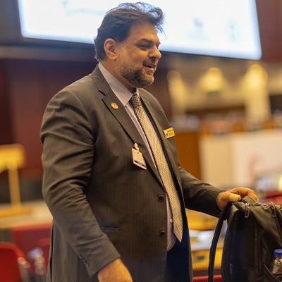 LSI Director Rabieh Razzouk in discussion on the conference floor.