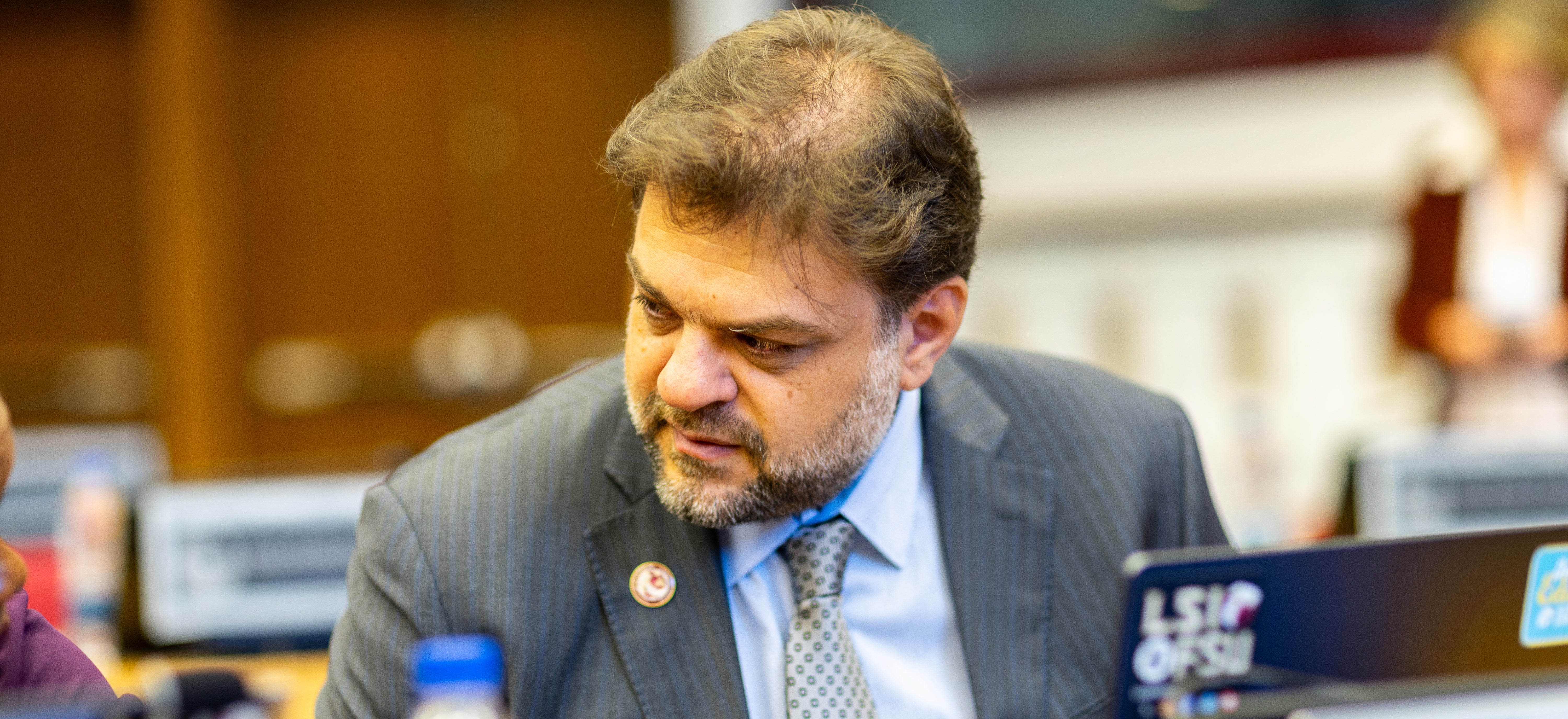 LSI Director Rabieh Razzouk sitting behind a laptop in discussion.