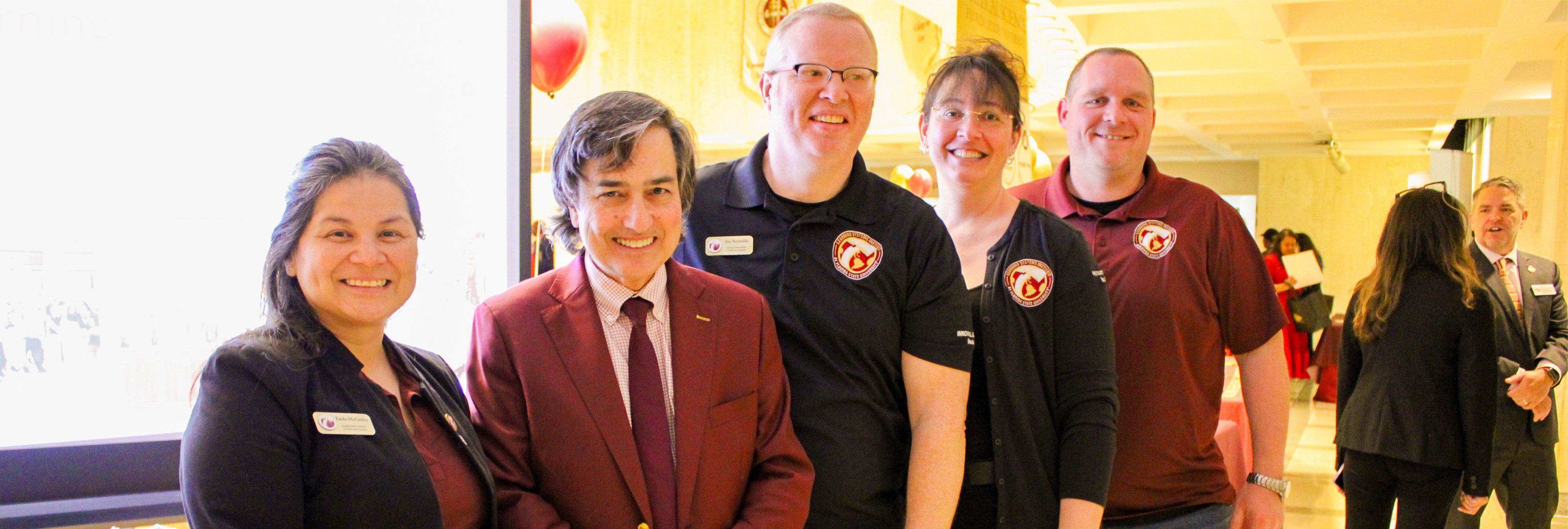 LSI staff pose for a photo with FSU Provost James Clark.