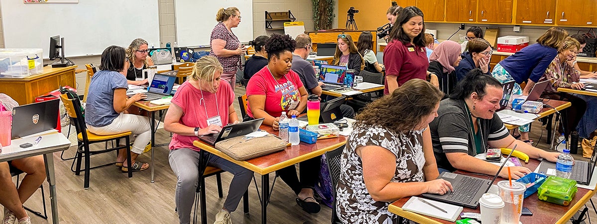 Classroom full of educators during a summer InSPIRE training session.