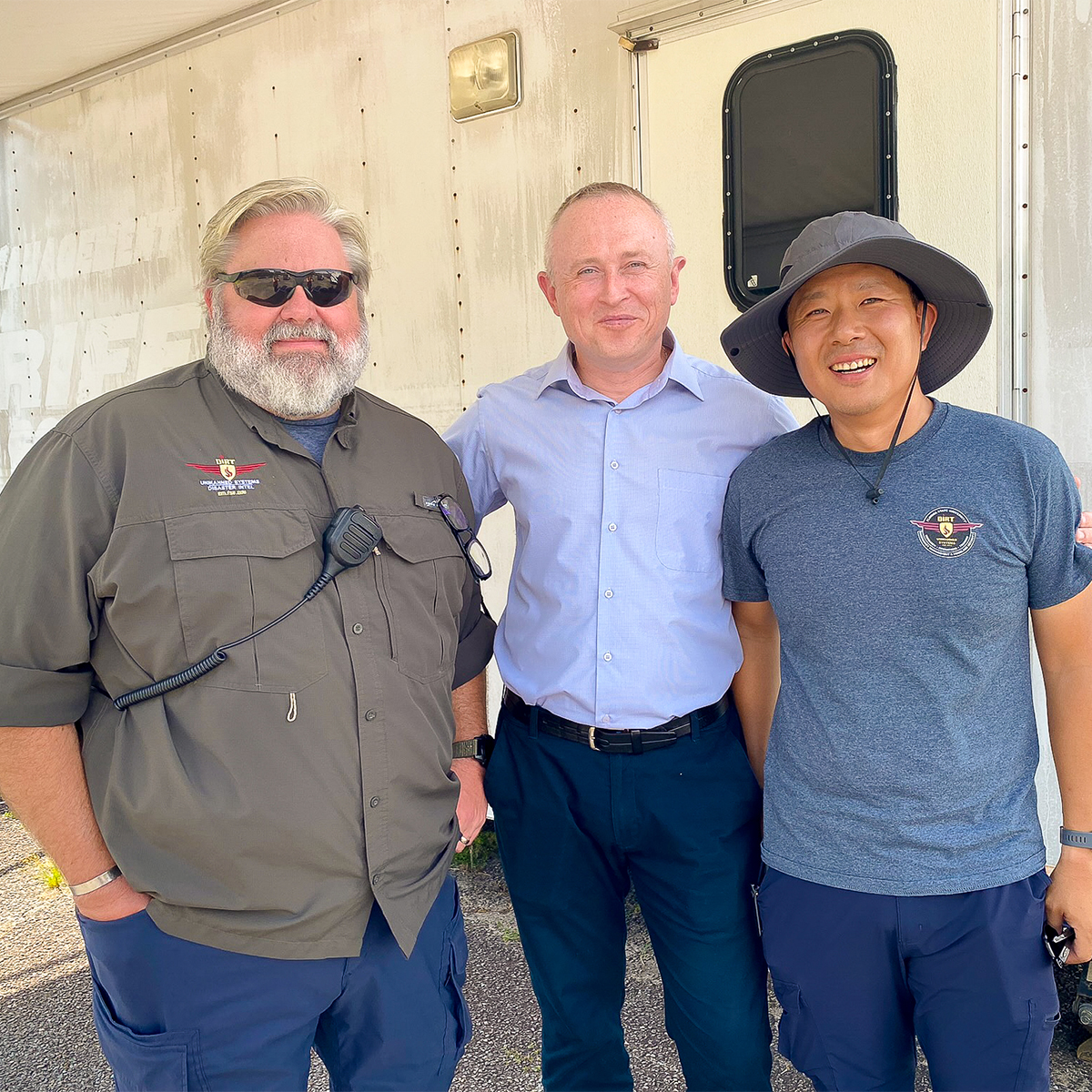 "Dr. Andrii Balendr with two members of FSU's Emergency Management team."