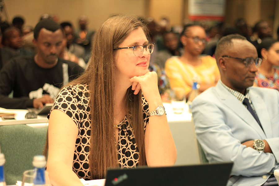 Adrienne Barnes-Story sitting behind a laptop at a presentation 
