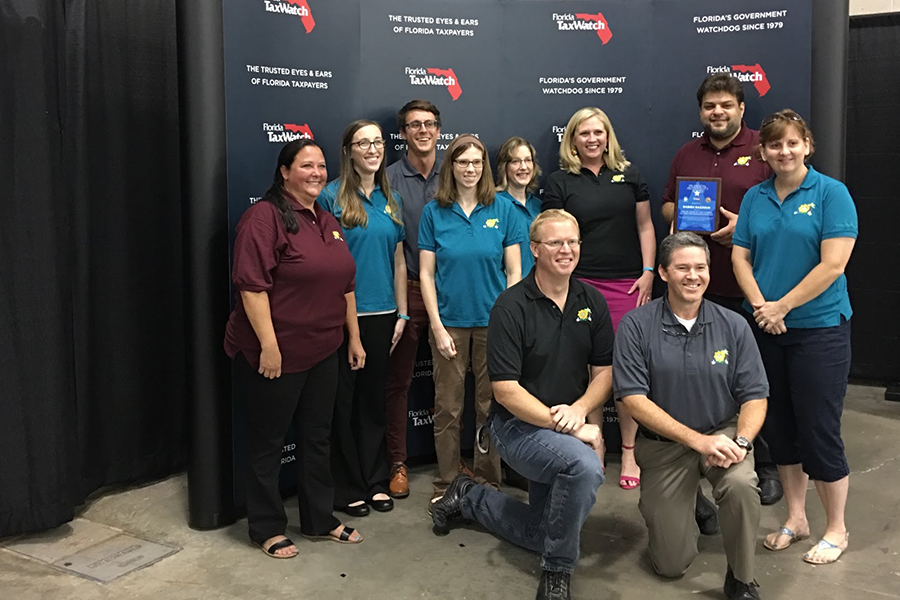 Gena St. John with a group posing at the Florida Tax Watch Awards 