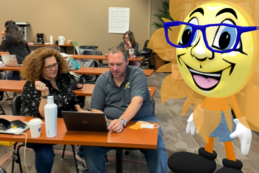 "Large AI generated CPALMS sun standing behind two people working at a table"