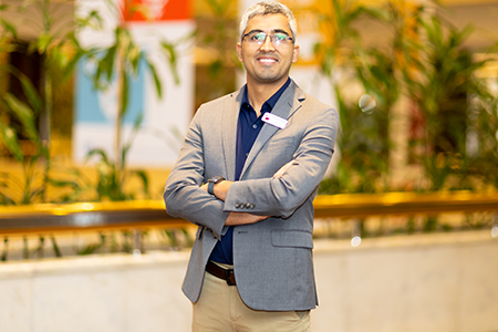 Bhushan Dahal posing at Educators Shaping Futures conference. 