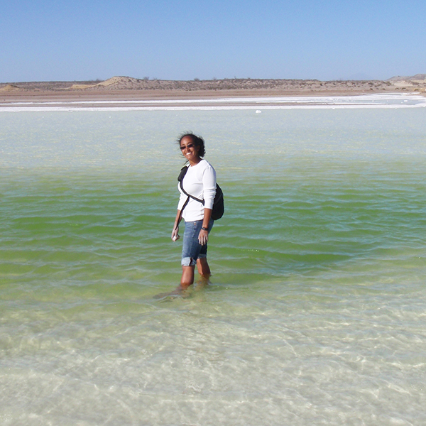 "Photo of Dr. Amanda Tazaz standing in the ocean."