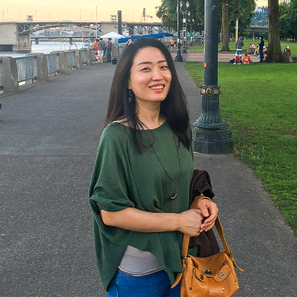 "Dr. Kim posing outdoors."