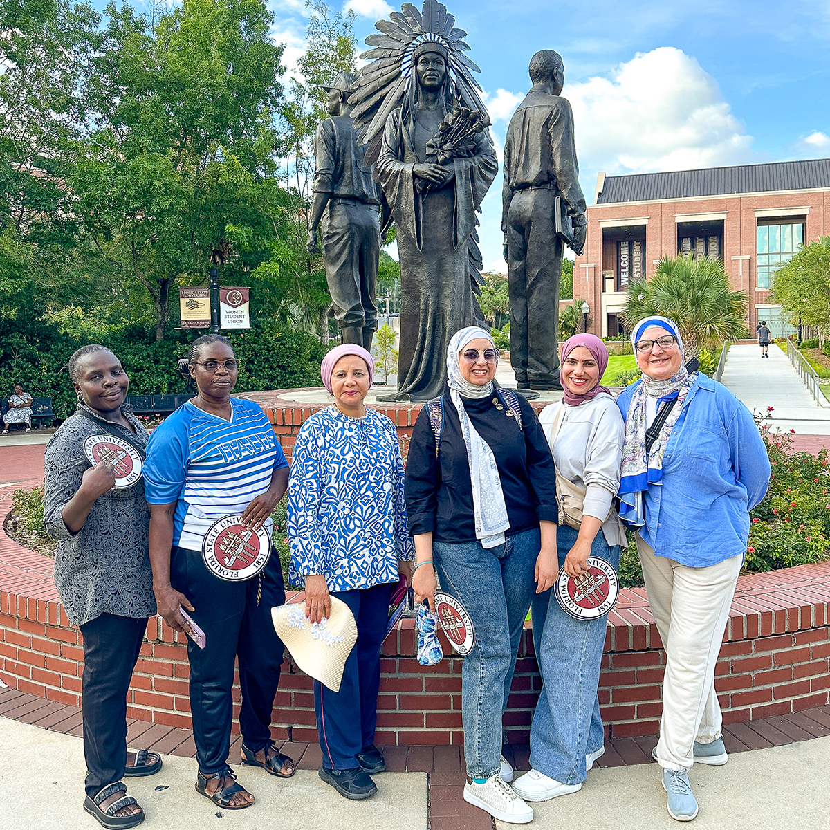 "Egyptian fellows posing for a photo with two Zambian fellows on the FSU campus."