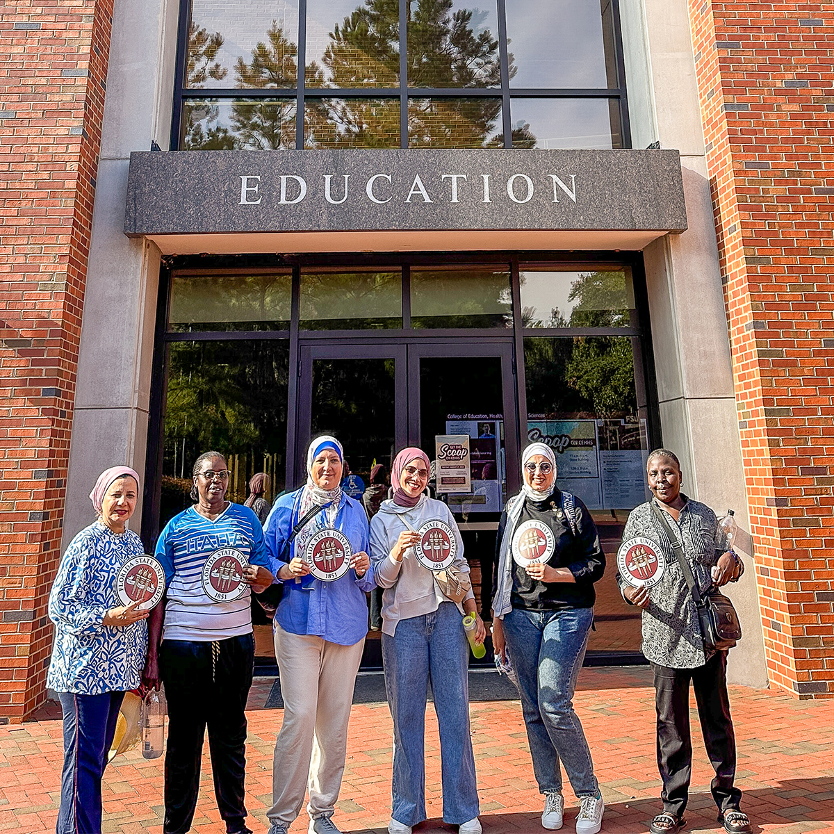"Egyptian fellows posing for a photo with two Zambian fellows on the FSU campus."