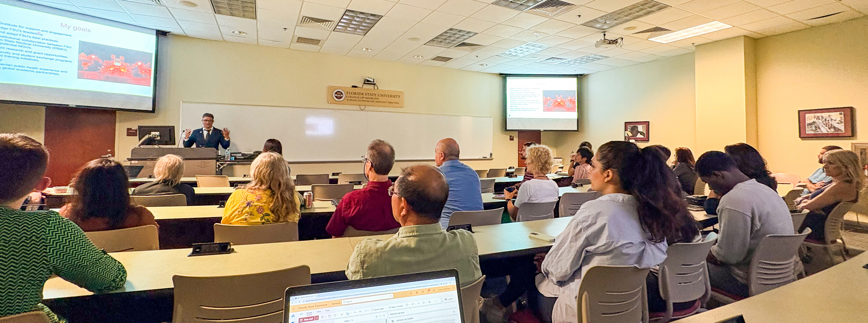 Dr. Dmytro Stepanskyi addressing a group at the FSU Medical School.