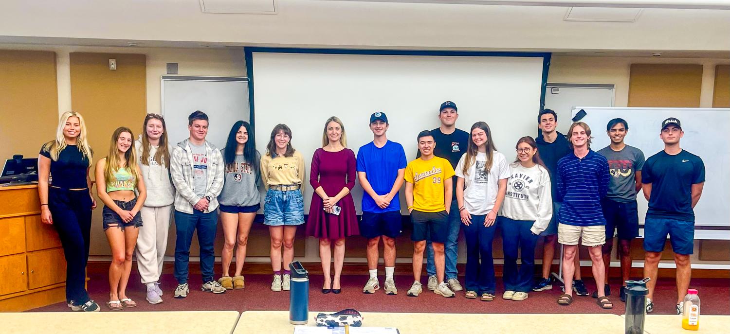 "Dr. Romanova takes a group phot At The Dedman College Of Hospitality"