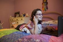 A sixth-grade student turns up the volume as she attends class through the digital academy at the The School of Arts and Sciences on Thomasville Road. (Courtesy of Robert Schoen)