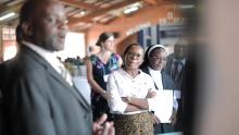 Group of people at a conference in a hall in Malawi. 
