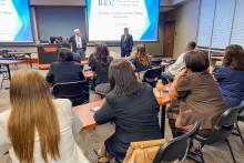 Presentation to the group in a classroom with two large screens