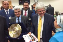 Member of the Egypt group presenting a man with a present