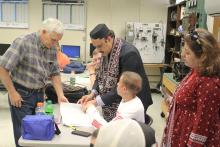 Group looking at a booklet