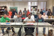 CCAP Pakistan group photo in a classroom
