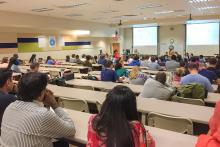 CCAP Pakistan group attending a lecture in a large classroom