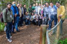 CCAP group posing outside at the Santa Fe College Teaching Zoo under trees