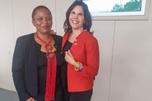 Two women pose for a photo