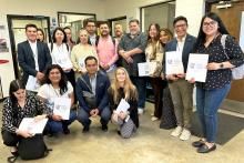 CCAP Mexico group photo holding folders from Lively Technical College