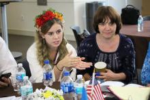 A member of the Ukraine CCAP in discussion seated at a table