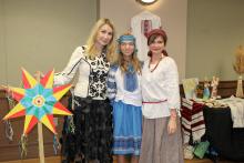 Dr. Anna Romanova poses for a photo with guests at the Vyshyvanka Day celebration.