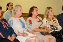 Dr. Anna Romanova and two guests at a lecture at the Vyshyvanka Day celebration on the FSU campus.