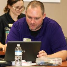 Photo of LSI STEM Specialist/Assistant in Research Robert Hanna working at a laptop.