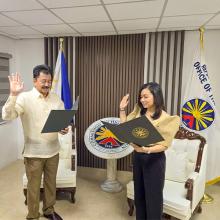 Dr. Michelle Aguilar-Ong being sworn in as the new special adviser for Local Colleges and Universities by the Commission on Higher Education in the Philippines. 