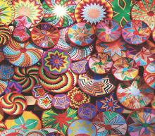 Photo of colorfully beaded circles. 