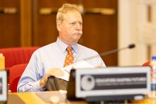 Steve McDowell sitting at a desk at the Educators Shaping Futures conference. 