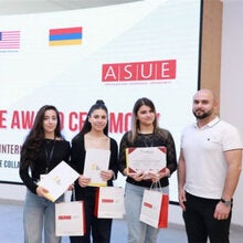 Group of students at Armenian State University of Economics pose with certificates of completion from the COIL program.