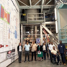 Participants in the Visiting Scholar Partnership Program pose for a photo inside the National High Magnetic Lab.
