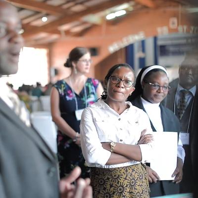 Group of people at a conference in a hall in Malawi. 