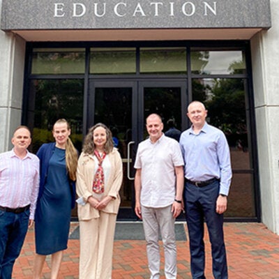 Group photo with Dr. Dina Vyortkina, Dr. Vilma Fuentes and BridgeUSA participants in front of Anne's College on the FSU campus. 
