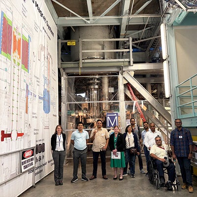 Participants in the Visiting Scholar Partnership Program pose for a photo inside the National High Magnetic Lab.