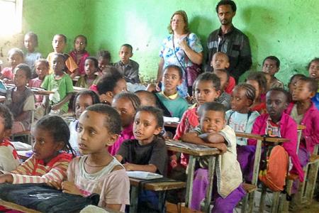 Classroom with children and two adults in the back in Ethiopia.