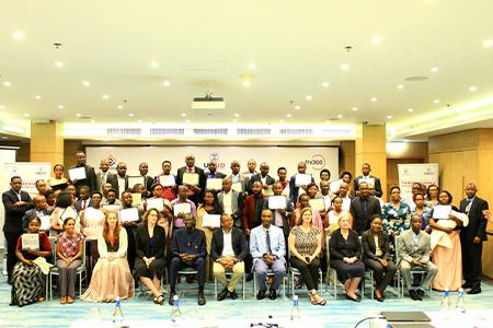 Group photo of participants in the Tunoze Gusoma Project with their certificates.