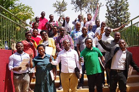 Group photo outdoors on a set of stairs.