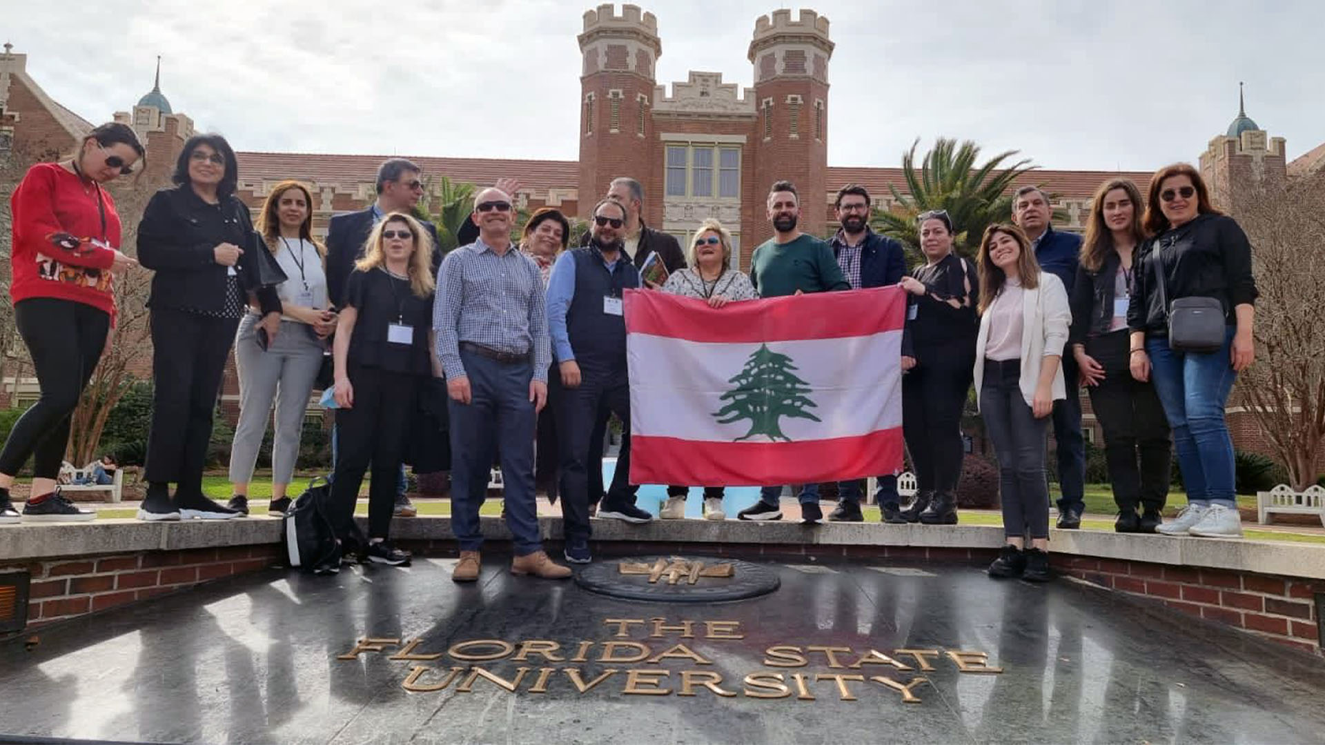 Lebanese university administrators pose with Lebanese at FSU's Westcott fountain