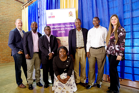 "Jeremy Koch (STEP Chief of Party), Dr. Symon Winiko, Associate Professor Allan Lipenga, Dr. Amos Chauma, Mr. Patrick Kapito, Dr. Adrienne Barnes-Story (STEP Project Director). Squatting: Dr. Mervis Kamanga  posing next to a banner for the USAID funded STEP project in Malawi."