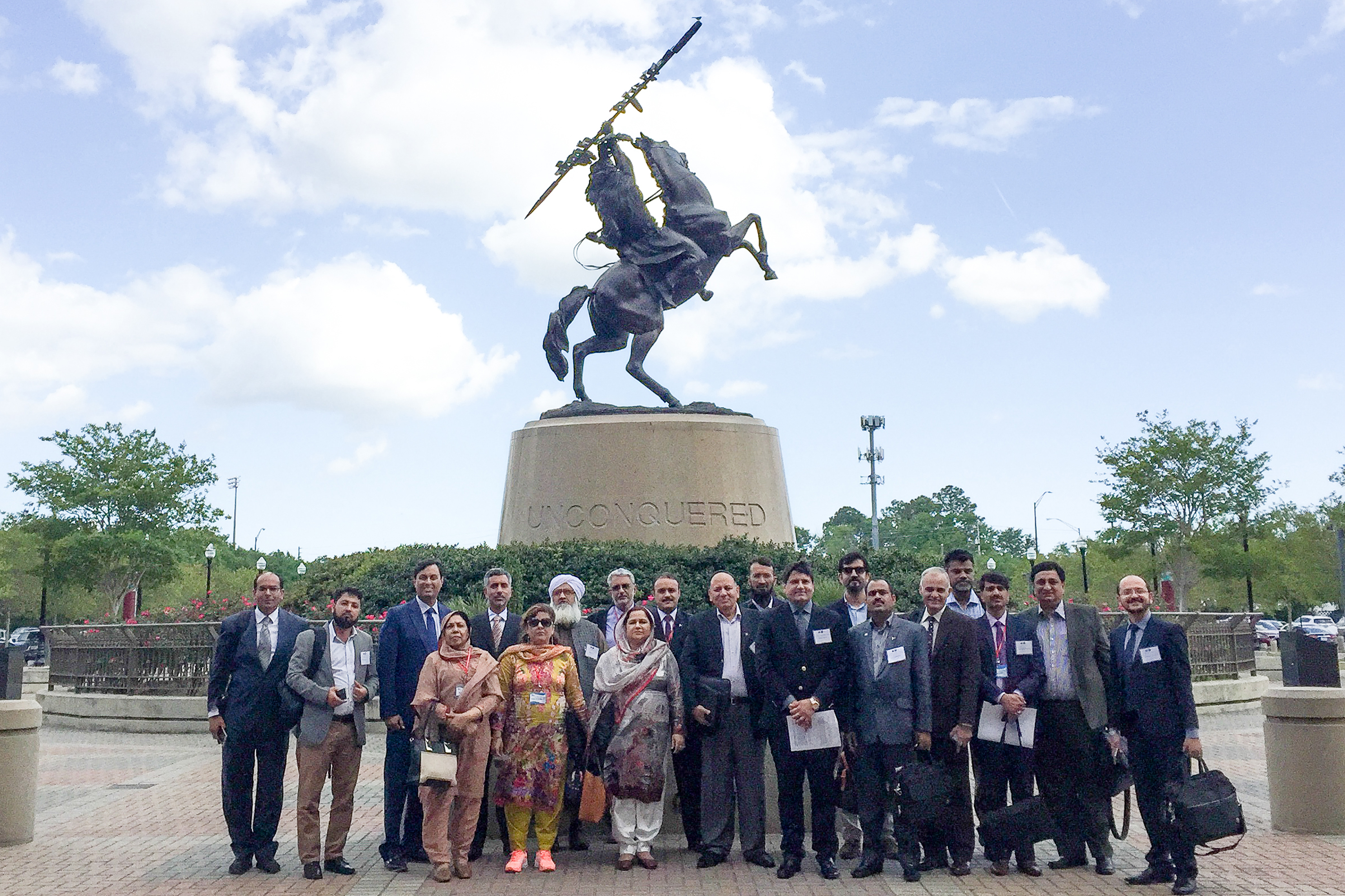 "CCAP Pakistan group posing in front of the Unconquered Statue at FSU"