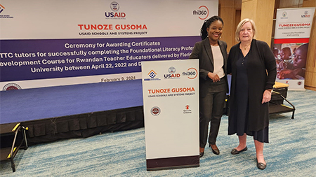 "Dr. Wawire and Dr. Fesmire posing at a Tunoze Gusoma event in Rwanda."