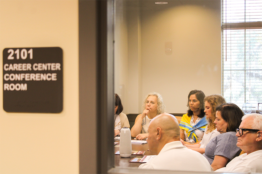 "Group sitting inside a career center conference room"